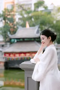 Graceful Vietnamese Beauty: A Serene Woman in White with a Lily-6