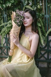 XVG No.1: Vietnamese Muse Blooms Beside a Colorful Flower Cart Elegance on City Streets [1000019847.jpg]-5