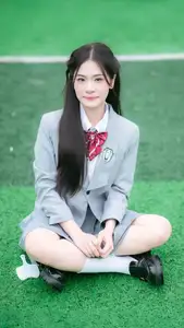 Cute Schoolgirl Frames a Moment on Green Grass-2