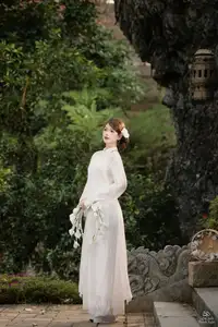 Elegant Asian Beauty: A Gentle Girl Adorned with a Pure White Orchid-3