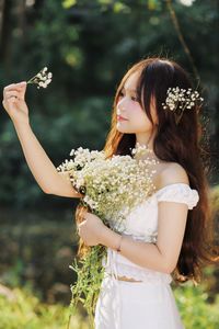 Captivating Portrait: Gentle Girl's Natural Beauty with Pure White Flowers in Golden Sunlight. Discover Her Grace.-7