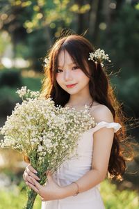 Captivating Portrait: Gentle Girl's Natural Beauty with Pure White Flowers in Golden Sunlight. Discover Her Grace.-6