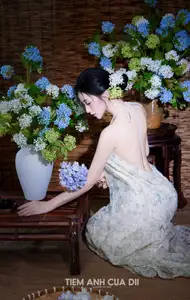 Ethereal Vietnamese Beauty: Graceful Asian Girl in Modern Yếm with Delicate Blooms.-6