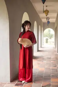 Discover the Timeless Elegance of a Vietnamese Woman in Red Ao Dai at Ancient Architecture.-6