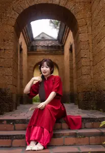 Discover the Timeless Elegance of a Vietnamese Woman in Red Ao Dai at Ancient Architecture.-3