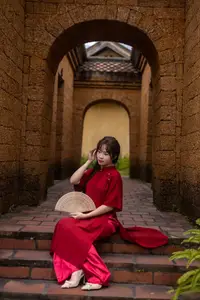 Discover the Timeless Elegance of a Vietnamese Woman in Red Ao Dai at Ancient Architecture.-5