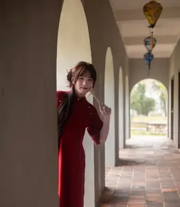 Discover the Timeless Elegance of a Vietnamese Woman in Red Ao Dai at Ancient Architecture.-8