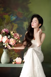 VGU No.98: Elegant Beauty in White Dress with Fresh Flowers – A Timeless Allure.-1