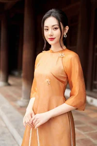 Timeless Grace: Amber Ao Dai in Ancient Architecture-1