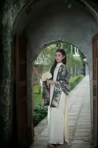 Graceful East Asian Beauty: Woman in Traditional Attire, Elegant with a Paper Fan.-2