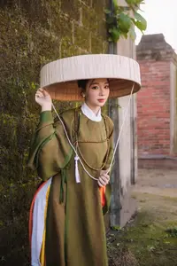 Timeless Vietnamese Charm: Elegant Girl in Traditional Attire and Nón Quai Thao-5