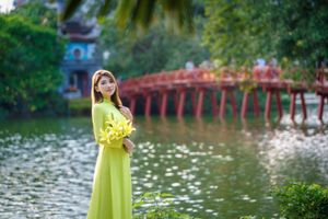 Serene Vietnamese Beauty: Woman in Ao Dai by the Lake-4