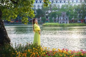 Serene Vietnamese Beauty: Woman in Ao Dai by the Lake-14