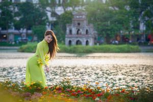 Serene Vietnamese Beauty: Woman in Ao Dai by the Lake-8