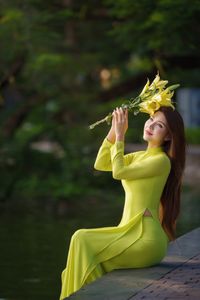 Serene Vietnamese Beauty: Woman in Ao Dai by the Lake-2