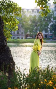 Serene Vietnamese Beauty: Woman in Ao Dai by the Lake-18