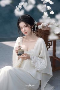 Discover Ethereal Grace: An Asian Beauty in Pure White Amidst Delicate White Blossoms-7