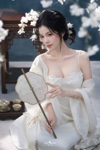 Discover Ethereal Grace: An Asian Beauty in Pure White Amidst Delicate White Blossoms-13