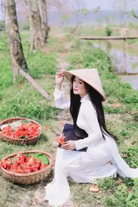 Elegant Vietnamese Student in Ao Dai Amidst Bauhinia Flowers-6