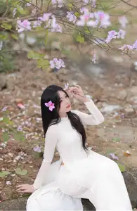 Elegant Vietnamese Student in Ao Dai Amidst Bauhinia Flowers-2