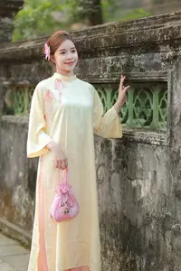 Graceful Vietnamese Girl in Traditional Ao Dai  Discover Timeless Beauty and Elegance-1