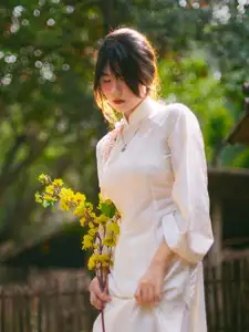 Graceful Asian Beauty: A Vietnamese Woman in Traditional Attire, Evoking Timeless-1