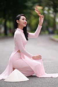 Pink Ao Dai Grace: Vietnamese Beauty with Elegant Girl and Traditional Conical Hat-12