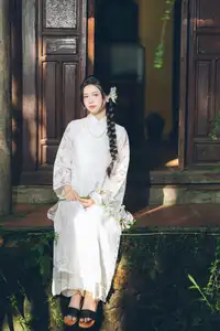 Charming Young Woman in White Lace & Orchids: Radiant Natural Beauty Amidst Greenery 1000026906-10