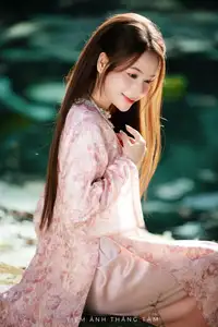 Vietnamese Charm: Elegant Beauty in Pink Traditional Attire-8