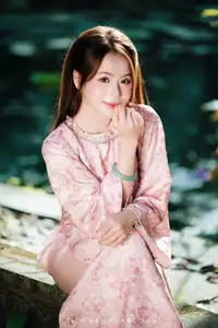 Vietnamese Charm: Elegant Beauty in Pink Traditional Attire-0