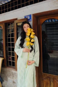 Stunning Transformation: Vietnamese Karate Champion Trang Cẩm Lành Embraces Elegance in Traditional Áo Dài Fashion-10