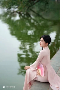 Graceful Muse in Traditional Pink Ao Dai-2